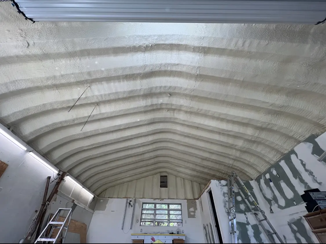 Spray polyurethane foam applied to the underside of a metal roof deck in Cobleskill